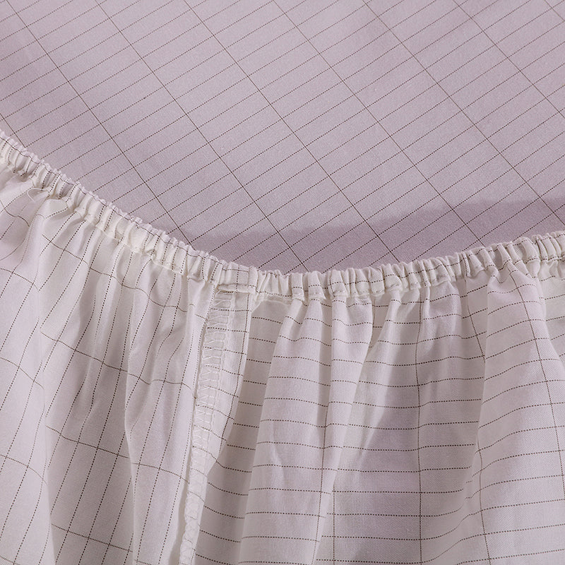 close up of white grounding fitted bedsheets